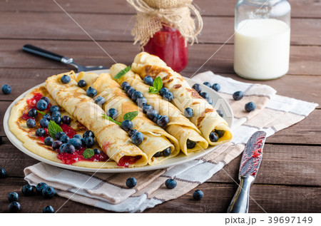 Pancakes with jam and blueberries 39697149