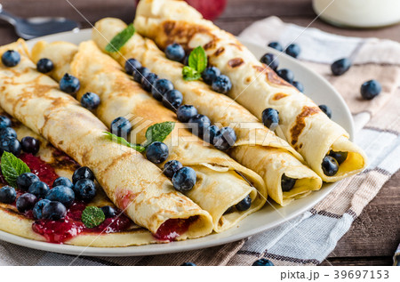 Pancakes with jam and blueberries 39697153