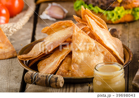 Homemade nachos with rustic burger 39698043