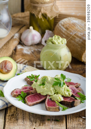 Beef steak with avocado dip and herbs Beef steak with avocado dip and herbs 39698209