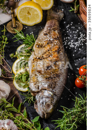 Grilled trout with herbs Grilled trout with herbs 39699834