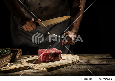 Chef butcher prepare beef steak Chef butcher prepare beef steak 39699983