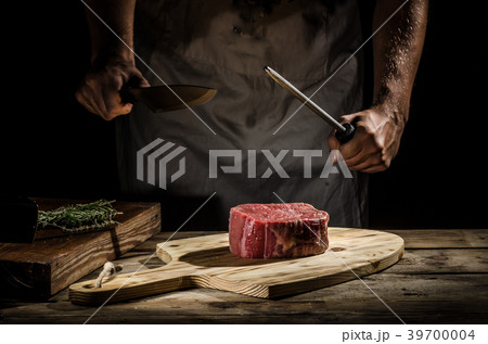 Chef butcher prepare beef steak Chef butcher prepare beef steak 39700004
