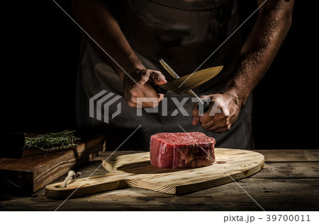 Chef butcher prepare beef steak 39700011