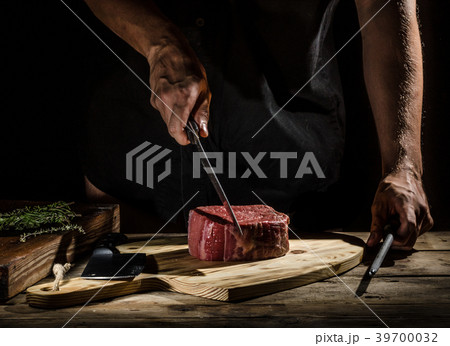 Chef butcher prepare beef steak Chef butcher prepare beef steak 39700032