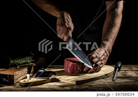 Chef butcher prepare beef steak Chef butcher prepare beef steak 39700034