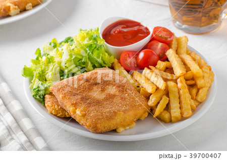 Fried cheese with french fries and lettuce Fried cheese with french fries and lettuce 39700407