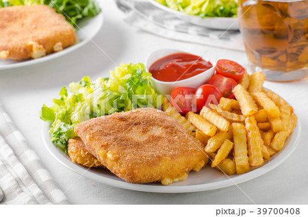 Fried cheese with french fries and lettuce 39700408