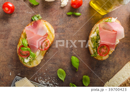 Toasted Tuscan bread with pesto Toasted Tuscan bread with pesto 39700423
