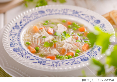 Spring chicken soup noodles, vegetable and toast Spring chicken soup noodles, vegetable and toast 39700958
