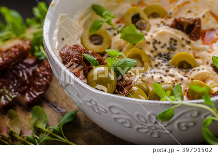 Fresh cheese with olives, dried tomatoes 39701502