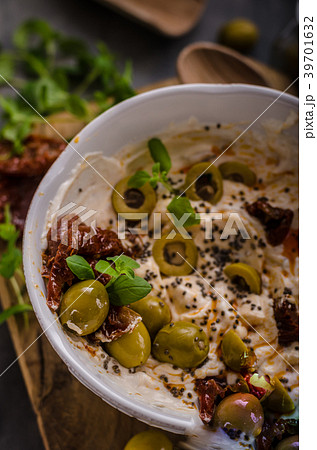 Fresh cheese with olives, dried tomatoes 39701632
