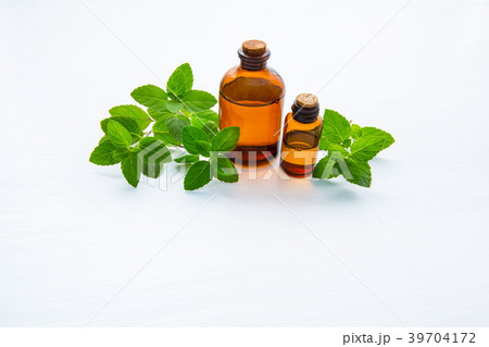 Natural Mint Essential Oil in a Glass Bottle. 39704172