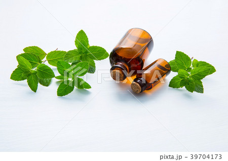 Natural Mint Essential Oil in a Glass Bottle. 39704173