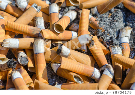 Large number of cigarette butts close-up 39704179