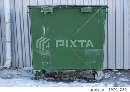 Green garbage bin. Municipal garbage dump. 39704286