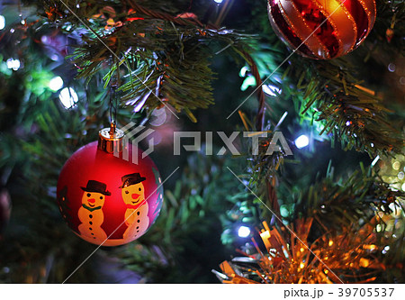 Colorful Christmas Baubles hanging on a tree 39705537