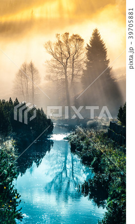 Foggy morning in the mountains with first sun Foggy morning in the mountains with first sun 39705881