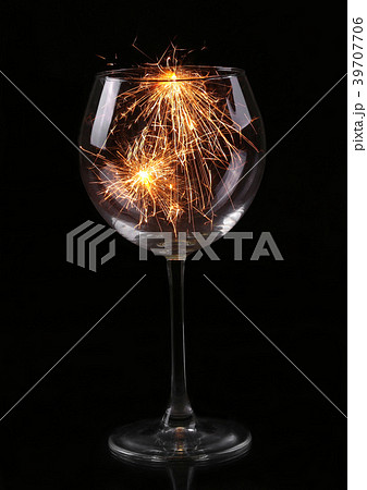 Wine glass with a sparkler. New Year and Christmas 39707706