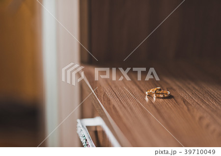 Wedding gold rings on the dresser 640. 39710049