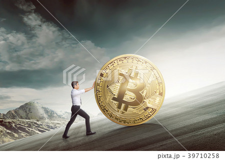 Young asian businessman pushing golden bitcoin 39710258