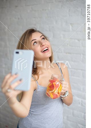 Pretty young caucasian girl taking selfie. 39710788