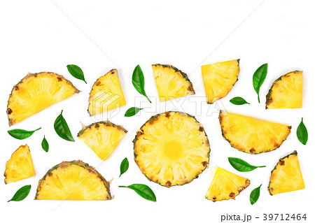 Sliced pineapple decorated with green leaves Sliced pineapple decorated with green leaves 39712464