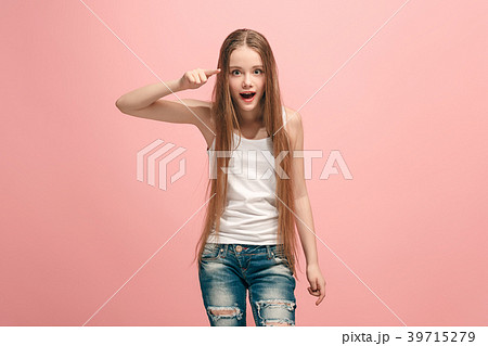 The happy teen girl pointing to you, half length The happy teen girl pointing to you, half length 39715279