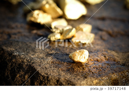 The pure gold ore found in the mine on stone floor 39717148