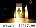 man silhouettes are standing outside at sunset 39717199