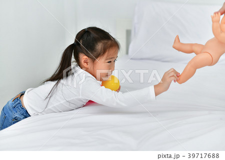 Family concept. Little girl is being annoyed by an adult. Little Family concept. Little girl is being annoyed by an adult. Little 39717688