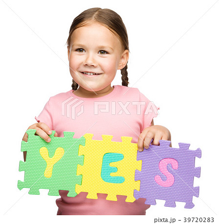 Cute little girl is holding Yes slogan Cute little girl is holding Yes slogan 39720283