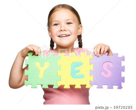 Cute little girl is holding Yes slogan Cute little girl is holding Yes slogan 39720285