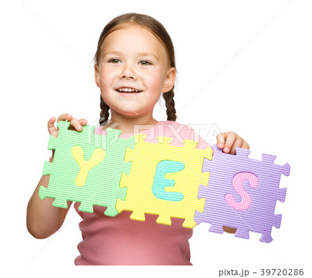 Cute little girl is holding Yes slogan Cute little girl is holding Yes slogan 39720286