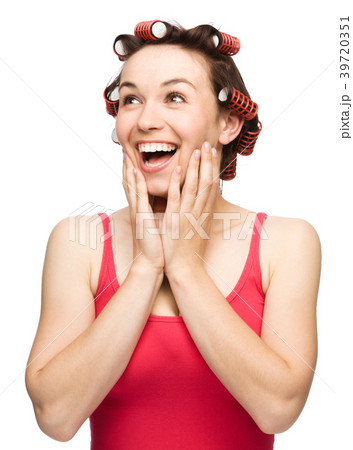 Woman is holding her face in astonishment 39720351