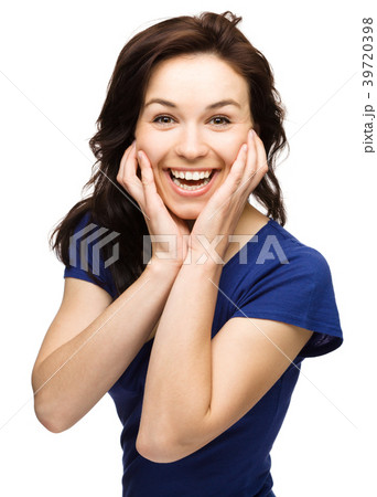 Woman is holding her face in astonishment 39720398
