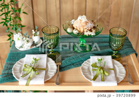 Close-up table setting with vintage rustic dishes. 39720899