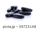 vitamins mix charcoal pills on white background 39723148