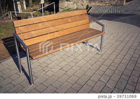 Wooden modern bench in the city with iron racks 39731069