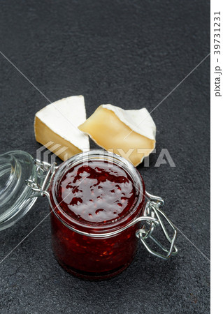 Jam of raspberries and pieces of brie cheese on 39731231