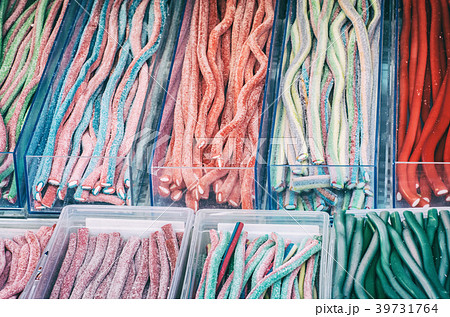 Multicolor tasty licorice candies in containers 39731764