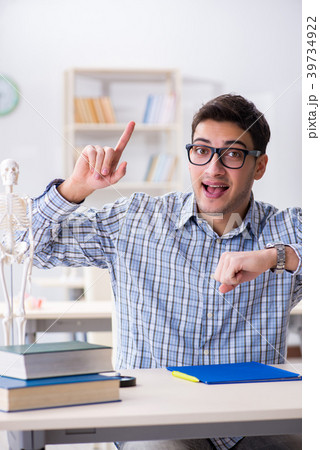 Medical student studying in classroom 39734922