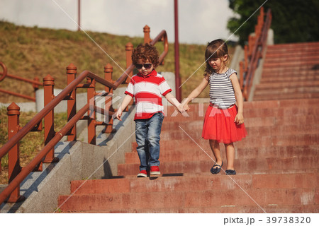 little boy and girl on stairway 39738320