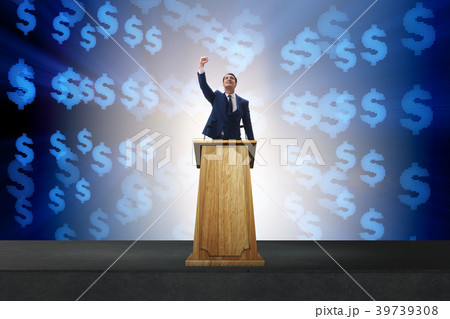 Man businessman making speech at rostrum in 39739308