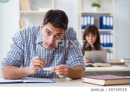Students sitting and studying in classroom college Students sitting and studying in classroom college 39739559