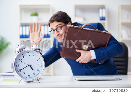 Businessman in bad time management concept 39739880