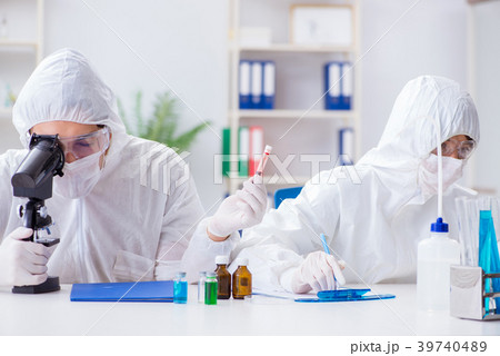 Two scientists working in the chemical lab Two scientists working in the chemical lab 39740489