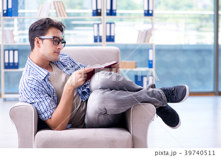Student reading books and preparing for exams in 39740511