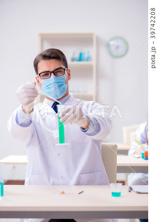 Man student working in chemical lab on experiment 39742208