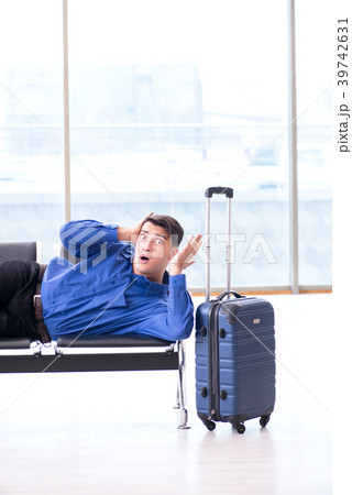 Man wairing to boarding in airport lounge room Man wairing to boarding in airport lounge room 39742631